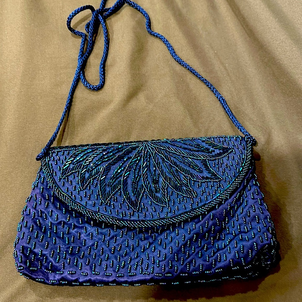 Beaded satin clutch bag.